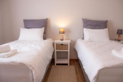 Katil atau katil-katil dalam bilik di Kramersdorf Guesthouse