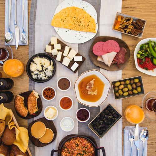 a table with many different types of food on it at Suna Sun Hotel - Adult Only in Kas