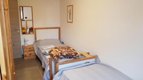 Postel nebo postele na pokoji v ubytování SAUZE 50 MT PISTE CLOTES