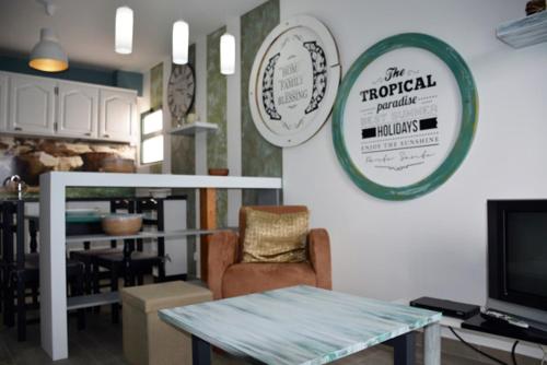 a living room with a table and a dining room at Porto Santo Apartment in Porto Santo