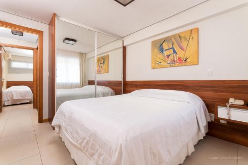 מיטה או מיטות בחדר ב-Aquaria Natal Hotel