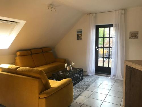 Ein Sitzbereich in der Unterkunft Ferienwohnung am Komisenpad