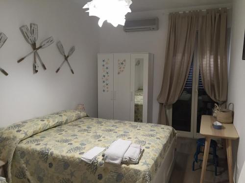 Säng eller sängar i ett rum på Casa Maritrì Locazione Turistica