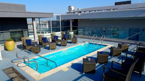 a swimming pool on top of a building at Porto Vista Hotel In Little Italy in San Diego