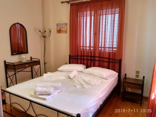 Postel nebo postele na pokoji v ubytování Manousos apartment