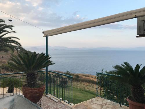 a balcony with a view of the ocean at Villa Castle Sea View in Paralion astros