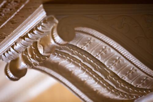 a close up of a wooden leg of a table at Hotel Lombardy in Washington