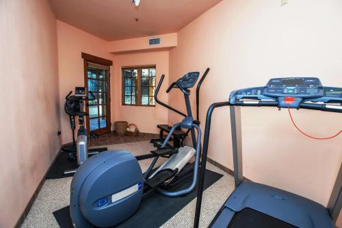 a gym with two exercise bikes and a treadmill at Inn on La Loma Plaza in Taos