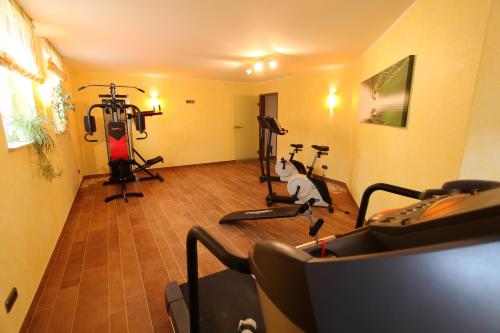 a gym with two treadying machines in a room at Landhotel Teuteberg in Bad Arolsen
