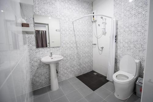 a bathroom with a toilet and a sink and a shower at Mr.T Kamala Room in Kamala Beach