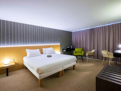 Cama o camas de una habitación en ibis Styles Kortrijk Expo