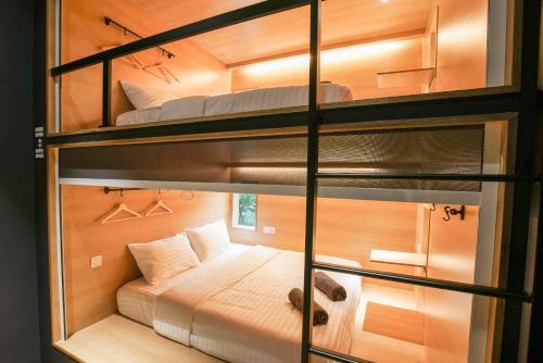 a small room with two bunk beds in it at The Bed KLCC in Kuala Lumpur