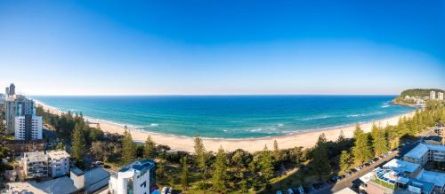 an aerial view of a beach and the ocean at Boardwalk Burleigh Beach - Official in Gold Coast