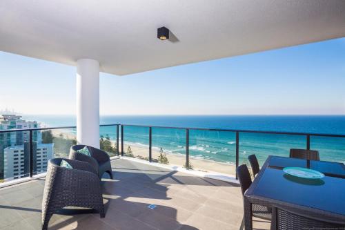 a beach scene with a view of the ocean at Boardwalk Burleigh Beach - Official in Gold Coast
