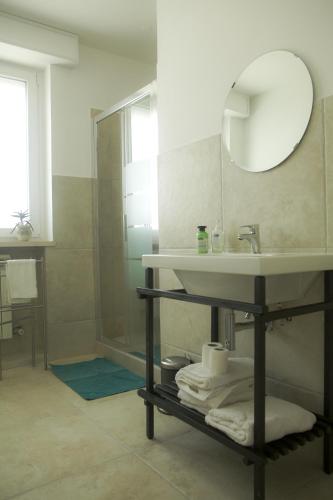 a bathroom with a sink and a mirror at Canneddi Boutique Farm in Avetrana