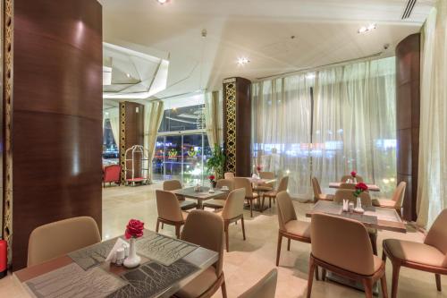 Restoranas ar kita vieta pavalgyti apgyvendinimo įstaigoje Al Muhaidb Al Olaya Suites