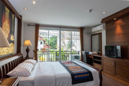 Кровать или кровати в номере Jomtien Beach Penthouses