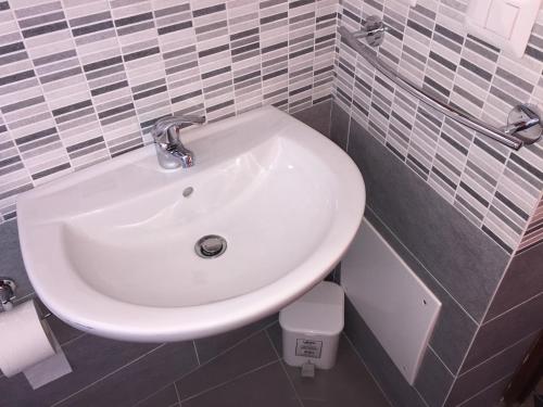 a bathroom with a white sink and a toilet at Stromboli Vacanze in Stromboli