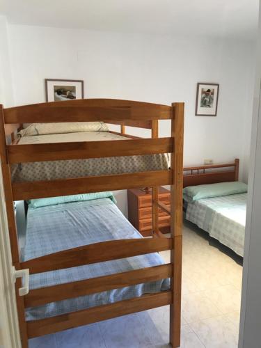 Ένα ή περισσότερα κρεβάτια σε δωμάτιο στο APARTAMENTO Nº 13 URB. CALA JOSEP