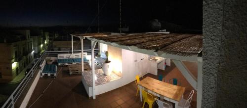 an overhead view of a building with a table and a roof at WePuglia - Santo Cosma - La Suite in Polignano a Mare