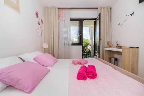 Postel nebo postele na pokoji v ubytování Guesthouse Adria