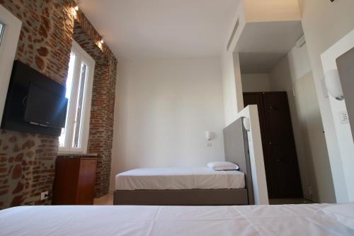 En eller flere senge i et værelse på NEW GENERATION HOSTEL Rome center