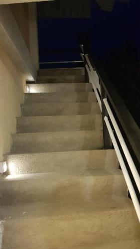 a set of stairs in a building at night at Mount View Inn in Kandy