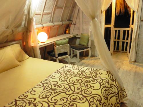 Krevet ili kreveti u jedinici u okviru objekta Uma Nandhi Ubud Natural Cottage