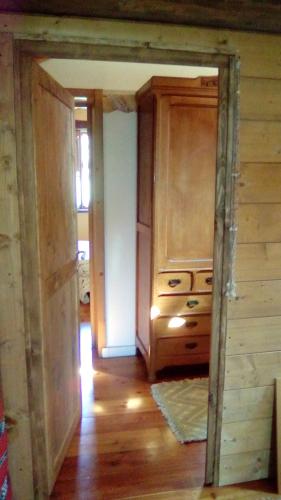 a room with a kitchen with a dresser in it at Il pettirosso di Giusvalla in Giusvalla