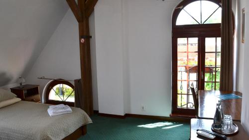 Postel nebo postele na pokoji v ubytování Tawerna Kaper