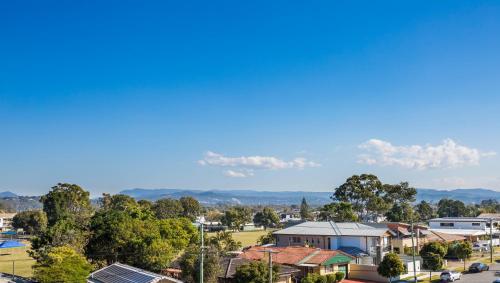 a view of a suburb with houses and trees at Boardwalk Burleigh Beach - Official in Gold Coast