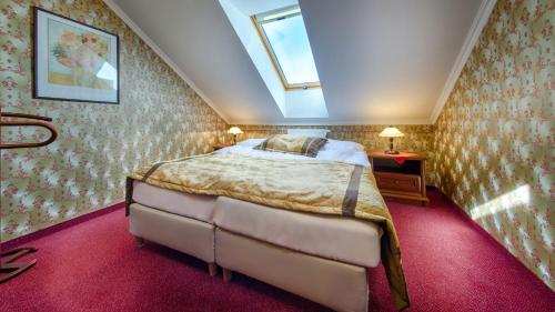 Un ou plusieurs lits dans un hébergement de l'établissement Hotel Tevel