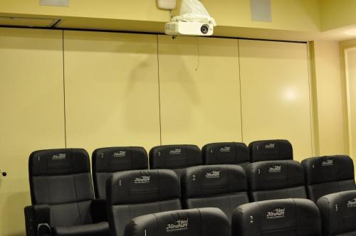 a room with a bunch of black seats in a theater at Hotel Miramare & Spa in Sestri Levante