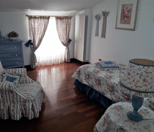 Un pat sau paturi într-o cameră la Villa Claudia indipendente con piscina ad uso esclusivo