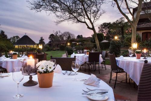 a table set up for a dinner party at night at Oliver`s in White River