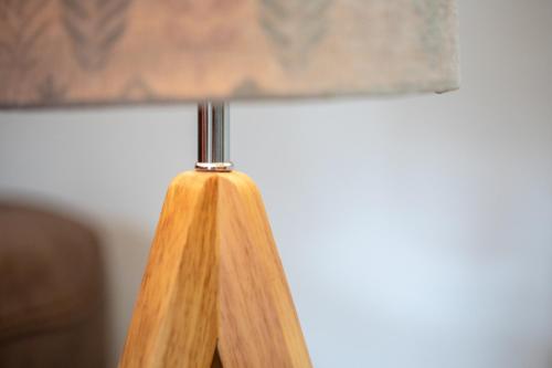 a close up of a wooden lamp with ainylinylinylinylinylinylinyl at Socair in Callander