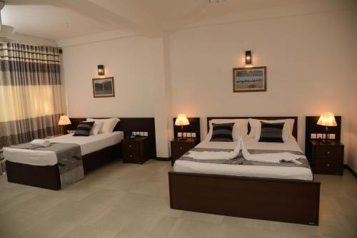 Cama o camas de una habitación en Riverside Inn Fuji