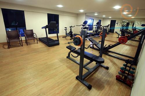 a gym with several treadmills and exercise bikes at Paradise Flat in Natal