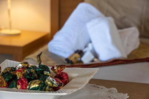 a plate of candy on a table in a hotel room at Antico Resort Cerasella in Petralia Soprana