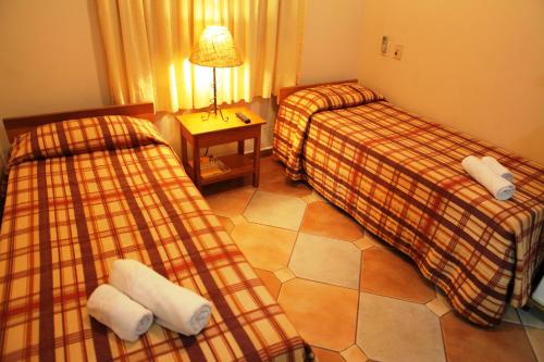 Una cama o camas en una habitación de Hotel Pirá Miúna