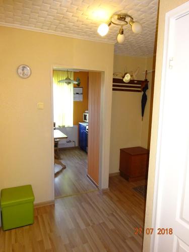 an empty living room with a dining room and a kitchen at Briedis un partneri in Cēsis