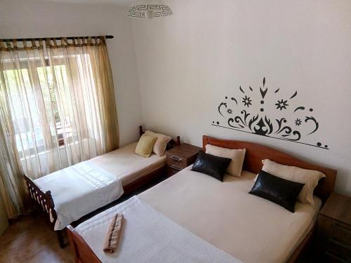 Postel nebo postele na pokoji v ubytování Apartments Vukotic