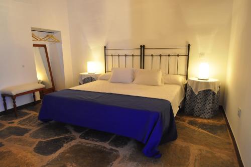 מיטה או מיטות בחדר ב-Casa Rural El Abuelo Alonso