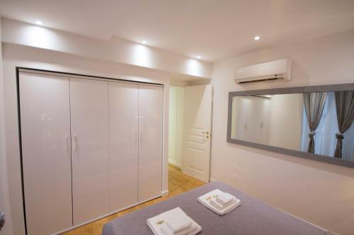 a room with a large white closet and a mirror at Apartment Via del Corso in Rome