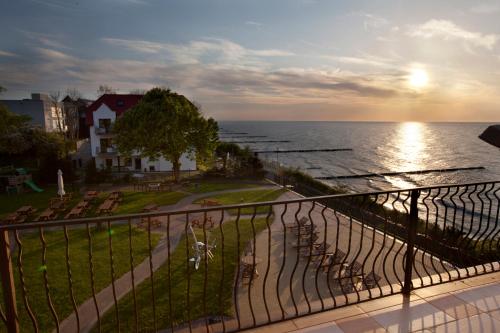 a view of the ocean from a balcony at Hotel Wodnik Twój Hotel z widokiem na morze in Ustronie Morskie
