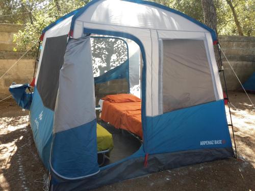 a blue and white tent with a bed in it at Agriturismo Vignavecchia in Vignacastrisi