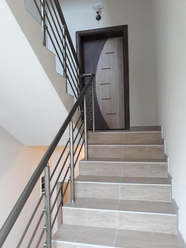 a set of stairs leading to a door at Vila & Apartments MATEA in Gevgelija