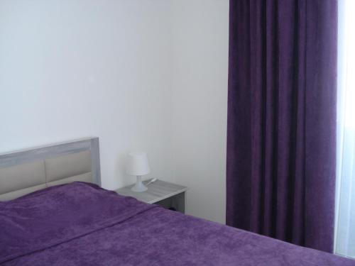 Ένα ή περισσότερα κρεβάτια σε δωμάτιο στο Batumi Boutique Apartment