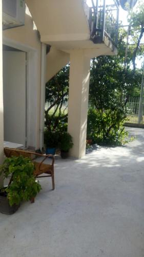 a porch with a bench and a balcony at Šušanj Ilino APARTMAN in Bar
