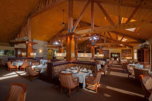 a dining room with white tables and chairs at South Coast Winery Resort & Spa in Temecula